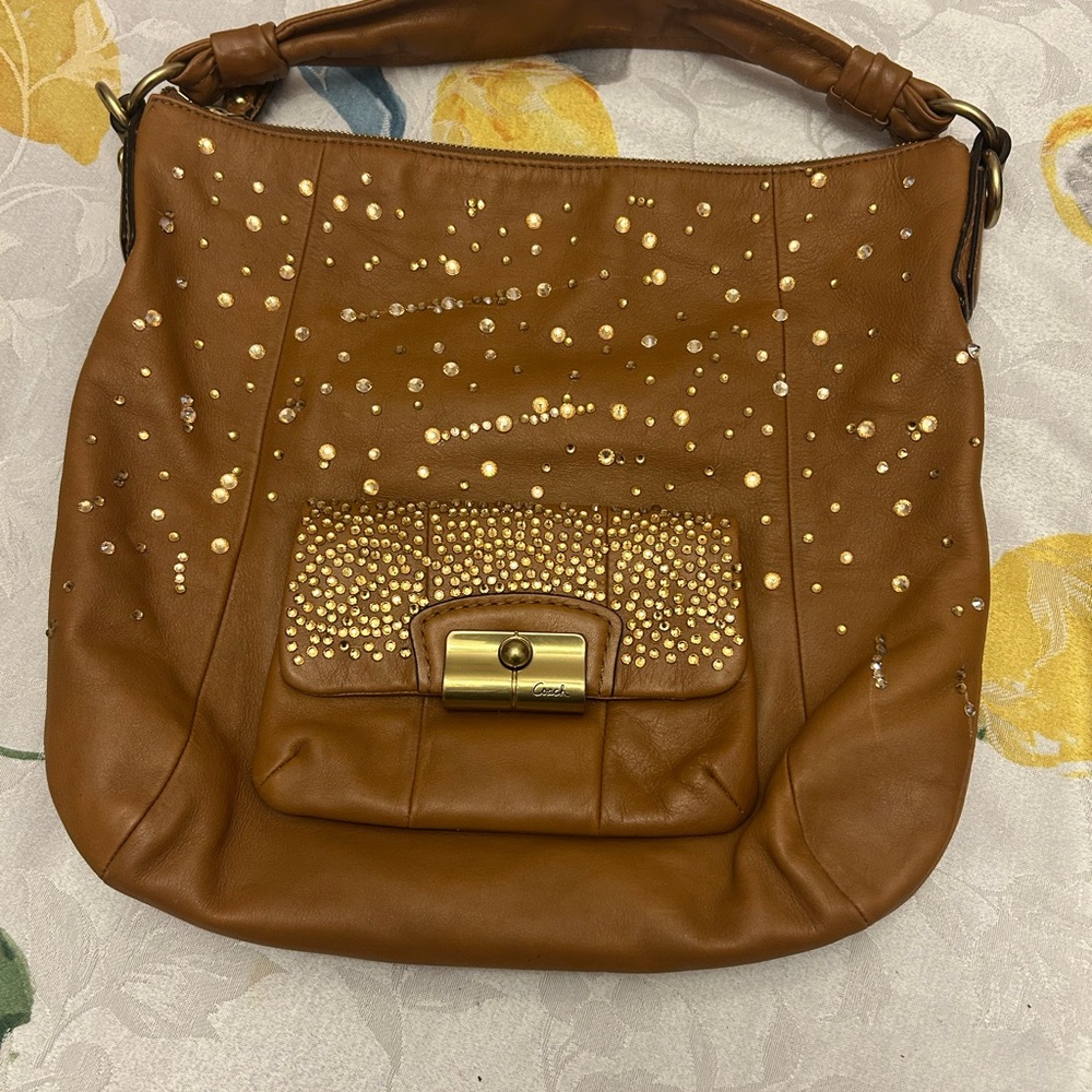 Up crafted Coach Women’s Brown Leather Studded Hobo Bag